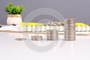 coin stack growth up on gray background. money saving, financial grow, business, economy budget and investment concept
