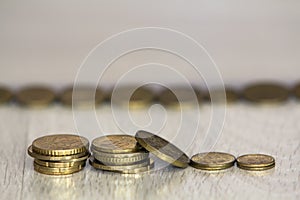 Coin stack or money stack and row of coin on wooden table. Financial, Business growth concept. Investment and saving concept.