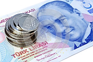 Coin stack over 100 TL Lira banknote