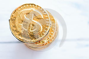 Coin sweet dollar on a wooden white background