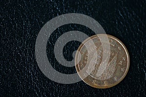 Coin in two euro cents on a dark background