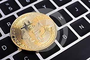 Coin, virtual golden bitcoin money on keyboard laptop ,