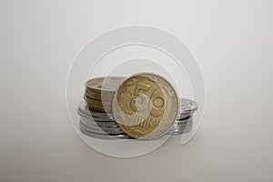 A coin worth fifty Ukrainian kopecks. coin on a white background is standing upright