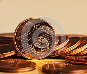 Coin worth two cents is on coins. Euro money.