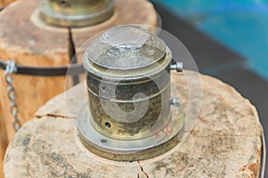 coinage equipment on wooden stamp close up.