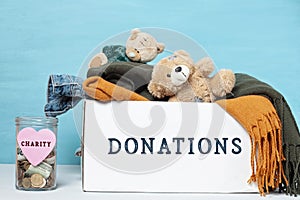 Coins, banknotes in money jar and box with donations