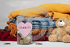 Coins, banknotes in money jar and box with donations