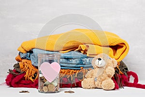 Coins, banknotes in money jar and box with donations