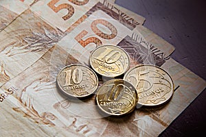 Coins and Banknotes on the wood table photo