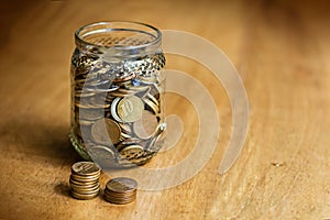 Coins and Banknotes on the wood table photo