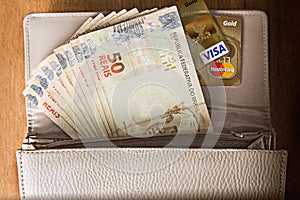 Coins and Banknotes on the wood table photo