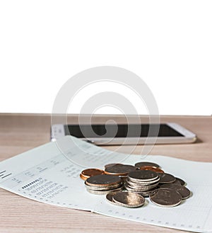 Coins on book bank account for money saving concept and white bl