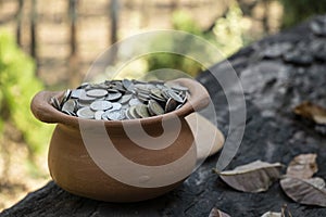 Coins in broken jar from on pile lots coin with blurred background, Money stack for business planning investment and saving