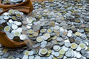 Coins in broken jar from on pile lots coin with blurred background, Money stack for business planning investment and saving