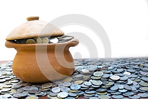 Coins in broken jar from on pile lots coin with blurred background, Money stack for business planning investment and saving