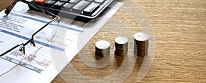 Coins With Calculator on financial diagrams. Finance conzept photo