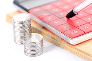 Coins and calculators, financial stills photo