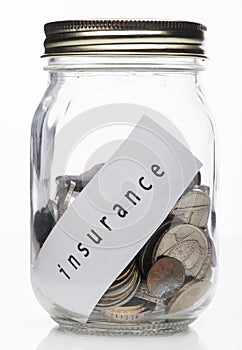 Coins in clear bottle with Insurance Note