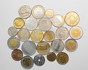 Coins from different countries on white