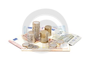 Coins and euro bills isolated in white