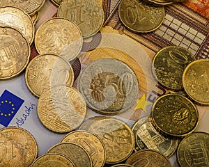 Coins euro cents are on a paper bill of fifty euros. Euro money