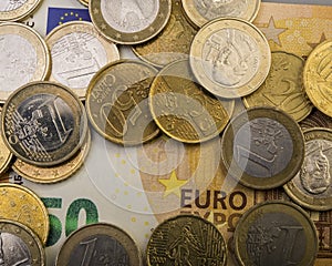 Coins euro cents are on a paper bill of fifty euros. Euro money