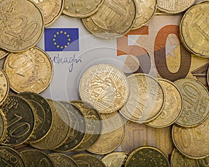 Coins euro cents are on a paper bill of fifty euros. Euro money