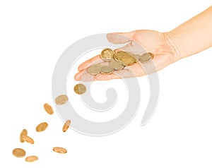 Coins fall out of the hands on a pile of gold coins