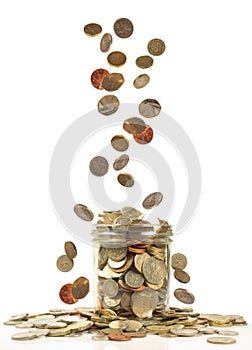 coins falling into a jar