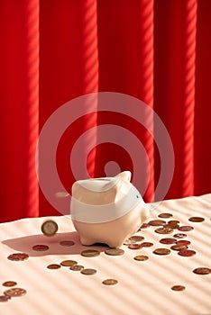 Coins falling into piggy bank. Money savings concept