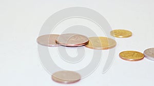 Coins are falling on the table. The magnetic power of money.