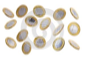 Coins falling on white background, effect and blur of movement and fall. Money rain photo
