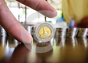 Coins between finger
