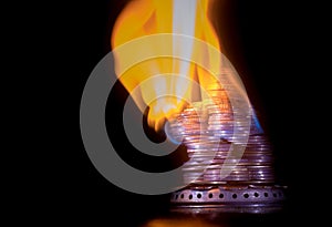 Coins on fire. The concept of high prices for natural gas.