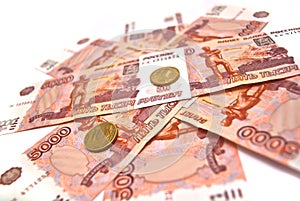 Coins and five thousand rubles banknotes