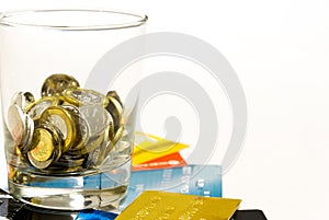 Coins glass and credit cards