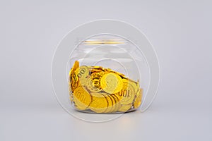 coins in glass jars, high exchange rate investment and gold stocks