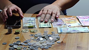 Coins on hand, coins on table, bitcoin, dirhams, euro coins, calculator and money