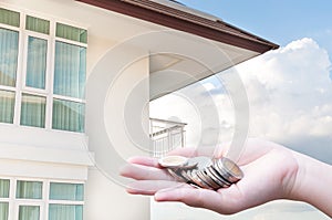 Coins in hands money Savings and apartment