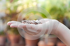 Coins in hands saving,Donation Investment Fund Financial Support Charity Dividend Market House