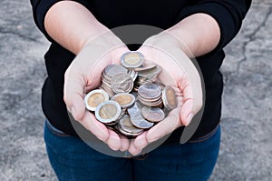 Coins in hands saving,Donation Investment Fund Financial Support Charity Dividend Market House