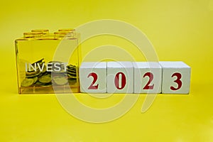 Coins in invest savings box, saving money and financial plan concept for investment in new year 2023. Money, Budget, tax,