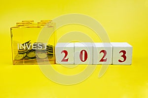 Coins in invest savings box, saving money and financial plan concept for investment in new year 2023. Money, Budget, tax,