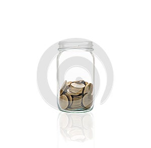 Coins in a jar, concept of cash accumulation for emergencies. photo