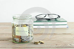 Coins in jar with Education label