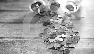 Coins in a jar on the floor. Accumulated coins on the floor. Sav