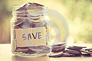 Coins in jar for money saving financial concept
