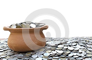 Coins in jar from on pile lots coin with blurred background, Money stack for business planning investment and saving