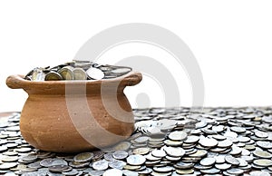 Coins in jar from on pile lots coin with blurred background, Money stack for business planning investment and saving