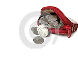 Coins in ladies purse on White background